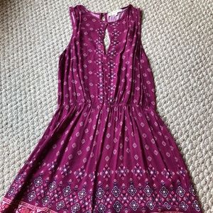 Rewind size medium romper; magenta pattern